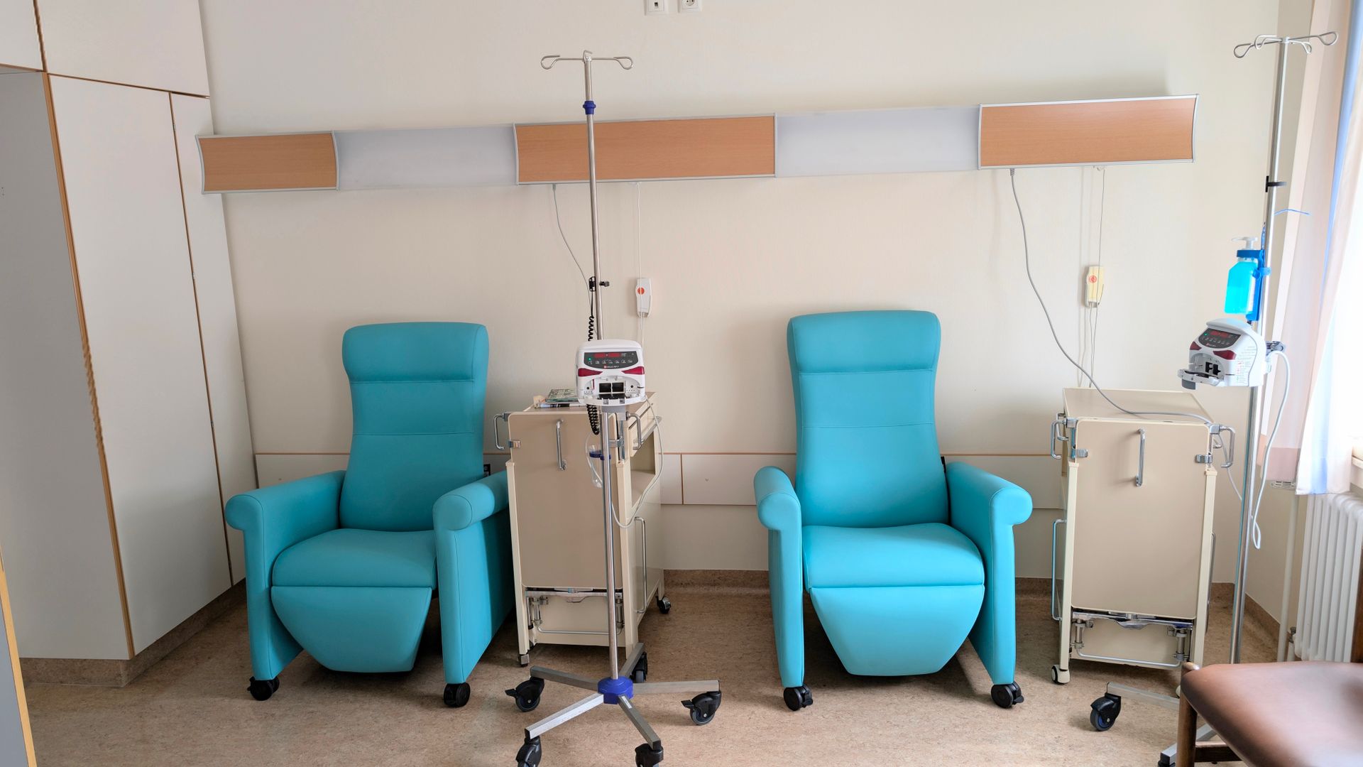 Empty chemotherapy chair in a hospital infusion unit