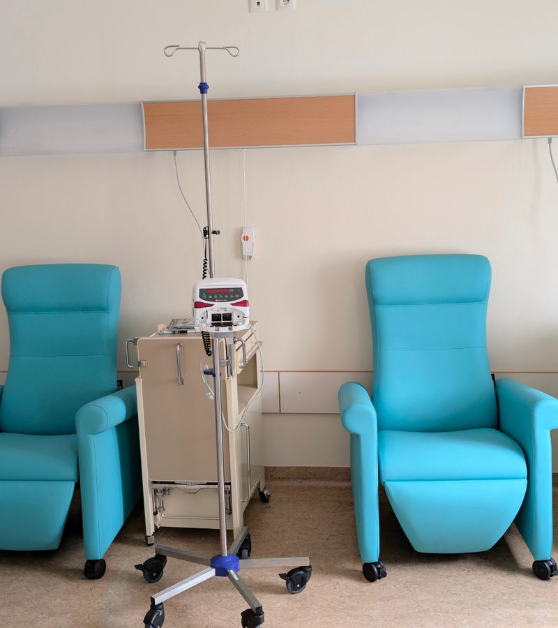 Calm hospital room featuring infusion chairs and equipment for chemotherapy treatment.
