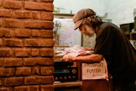 Man Wearing Black Crew-neck T-shirt Playing Music