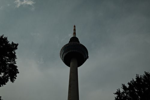 Free Moody silhouette of a TV tower with cloudy sky, showcasing architectural beauty and atmospheric mood. Stock Photo