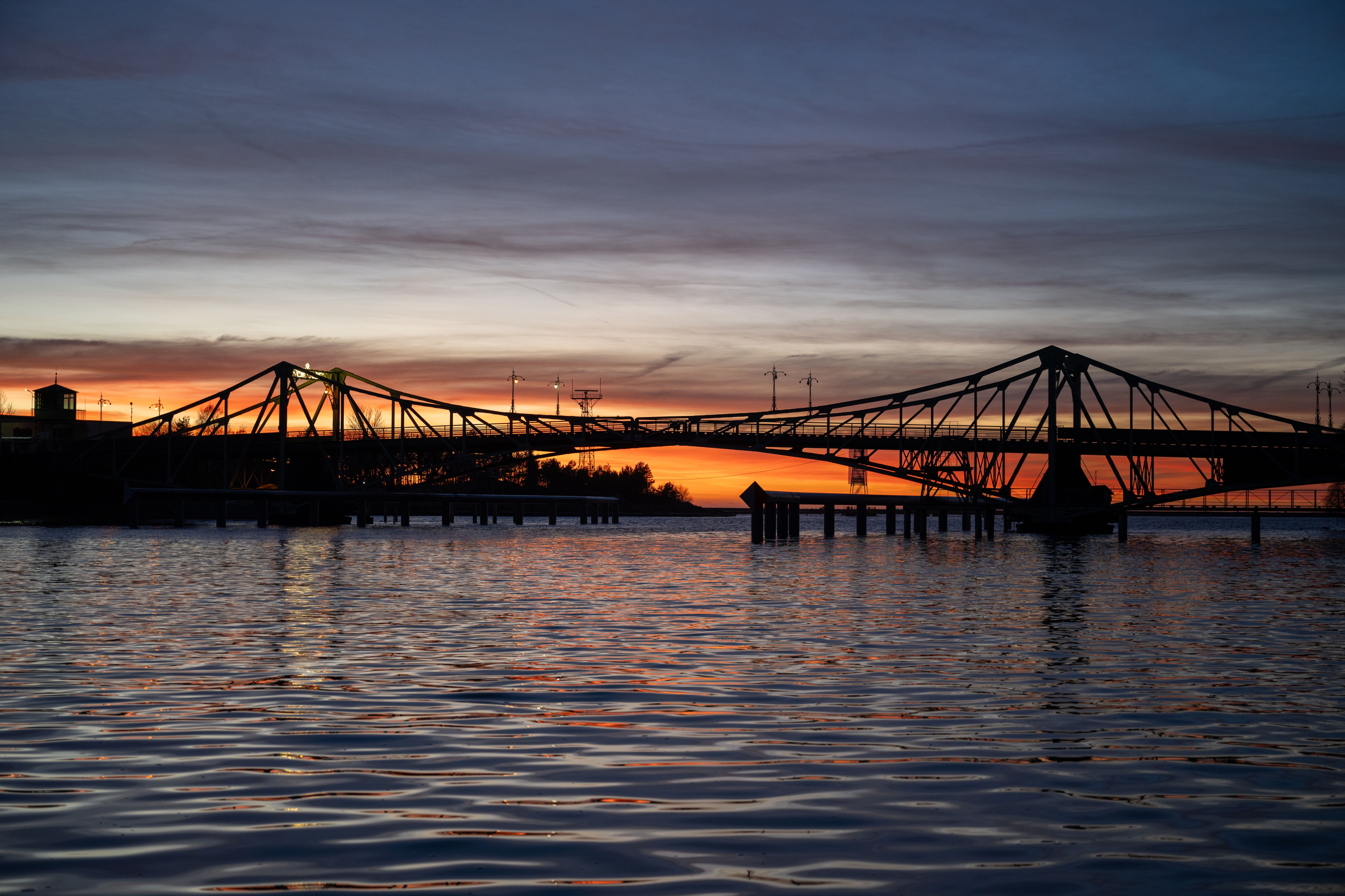 Silhouette of People Walking on Bridge · Free Stock Photo