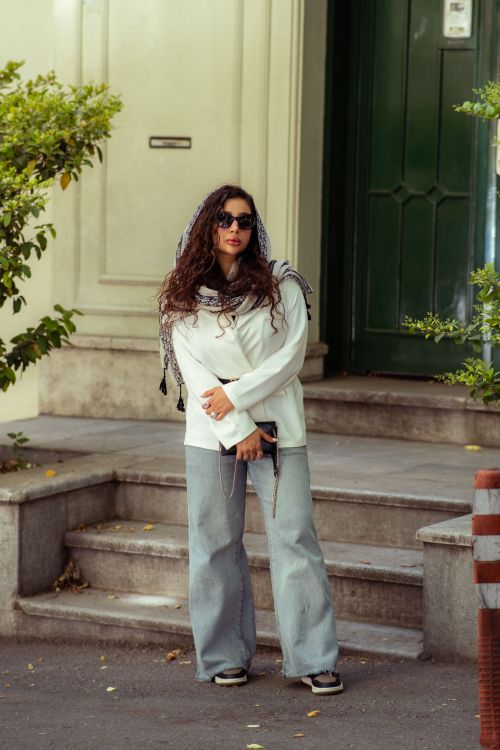 Free Stylish woman in Tehran showcasing urban fashion with a modern look outdoors. Stock Photo