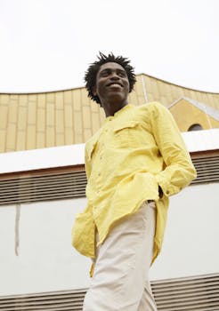 Stylish portrait of a man in Berlin with modern architecture backdrop.