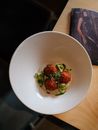 Elegantly plated gourmet croquettes with fresh herbs and cucumbers.