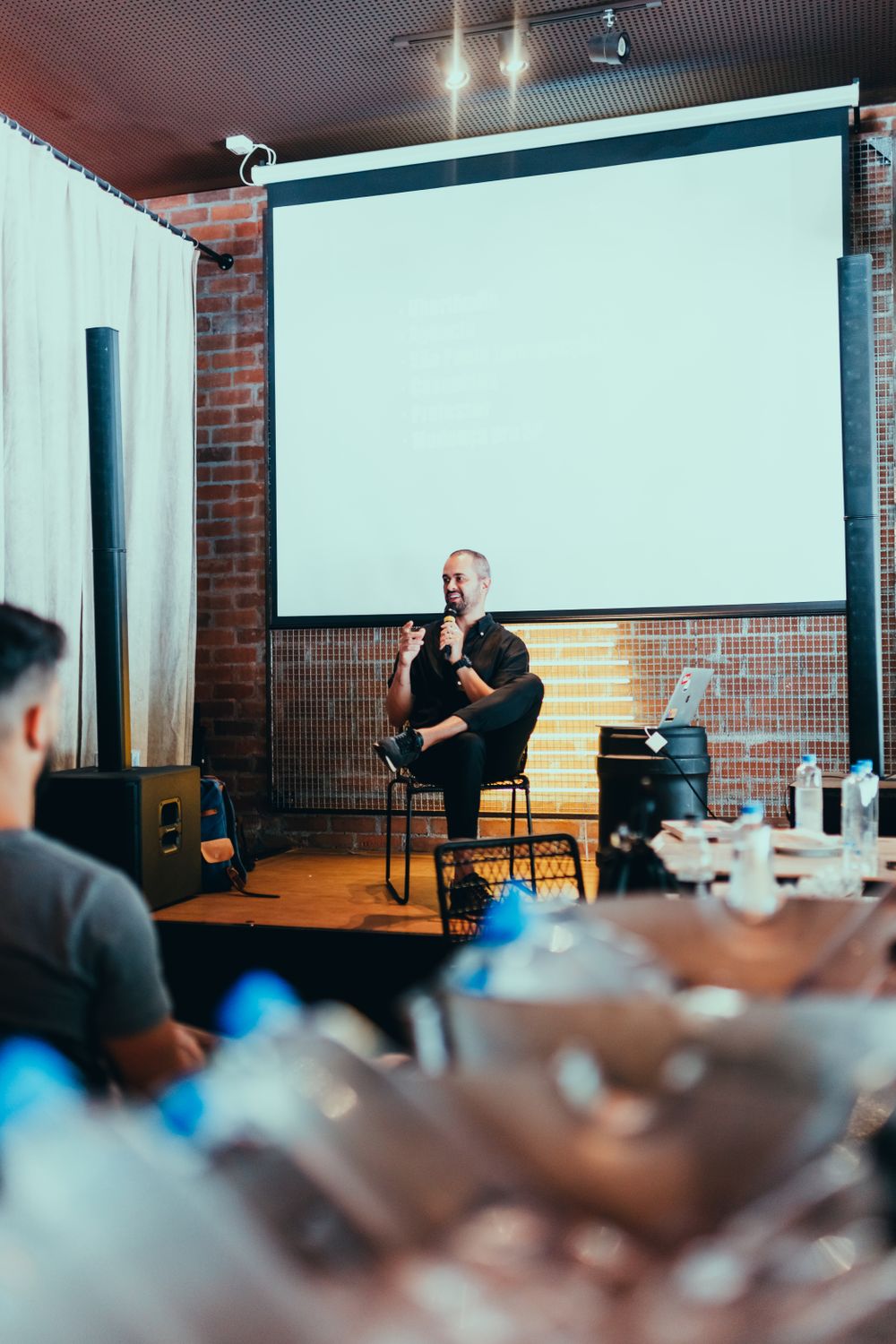 People participating in a moderated professional discussion