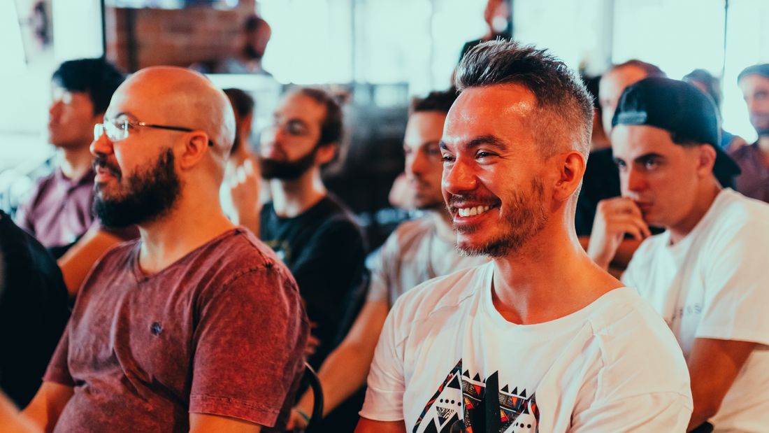 The room laughing through a session at the company retreat — photo by Matheus Bertelli on Pexels