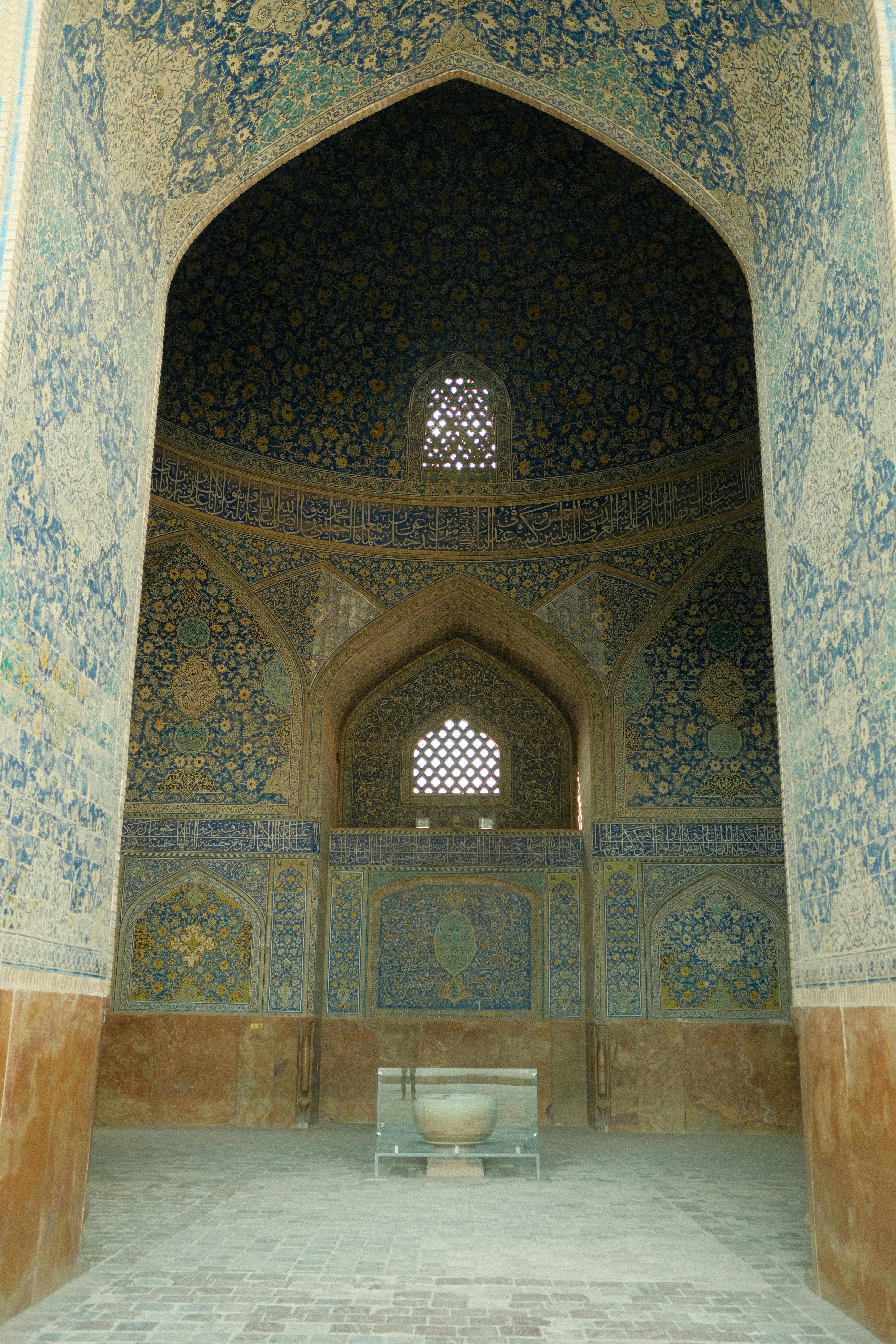 Explore the intricate tilework of Isfahan's historical mosque interior, showcasing Persian architectural beauty.