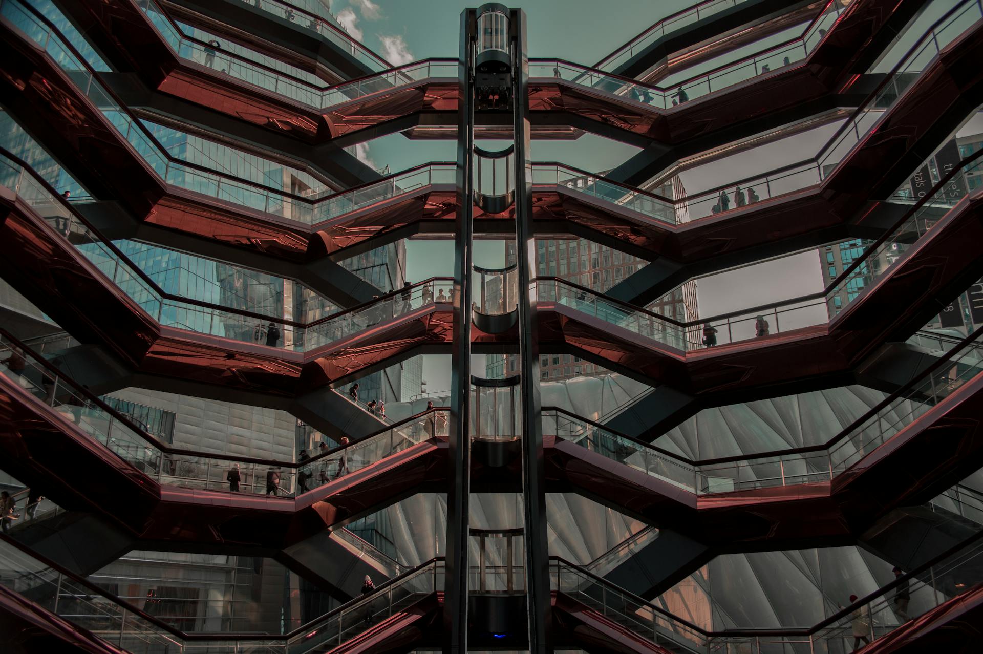 The Vessel at Hudson Yards, New York, showcasing modern architectural design with sleek lines and a futuristic vibe.