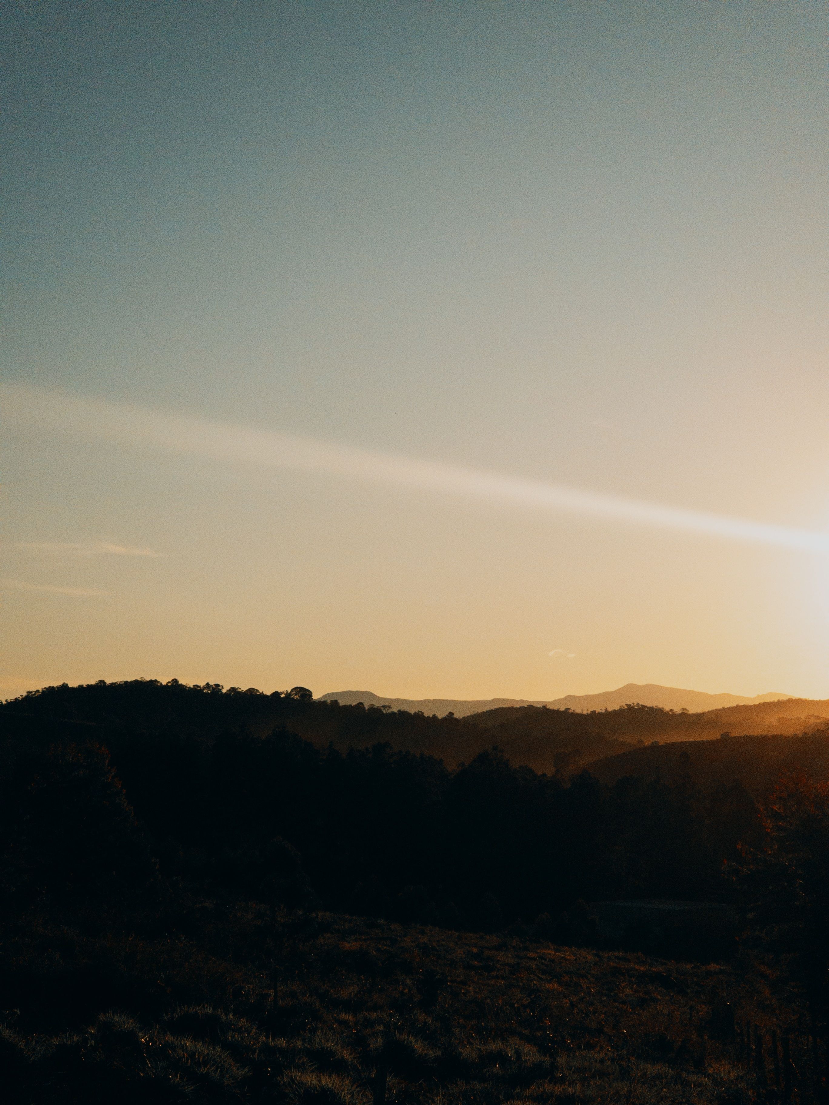 Serene Sunset Over Rolling Hills Landscape · Free Stock Photo