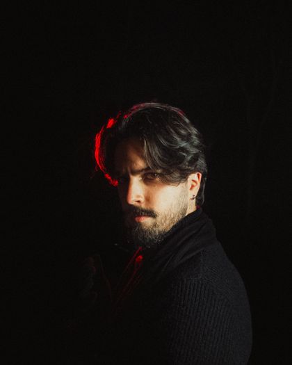 Moody low-key portrait, photo by Allan Carvalho on Pexels