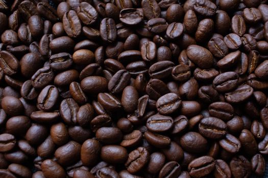 A detailed view of dark roasted coffee beans, ideal for rich and aromatic coffee brews.