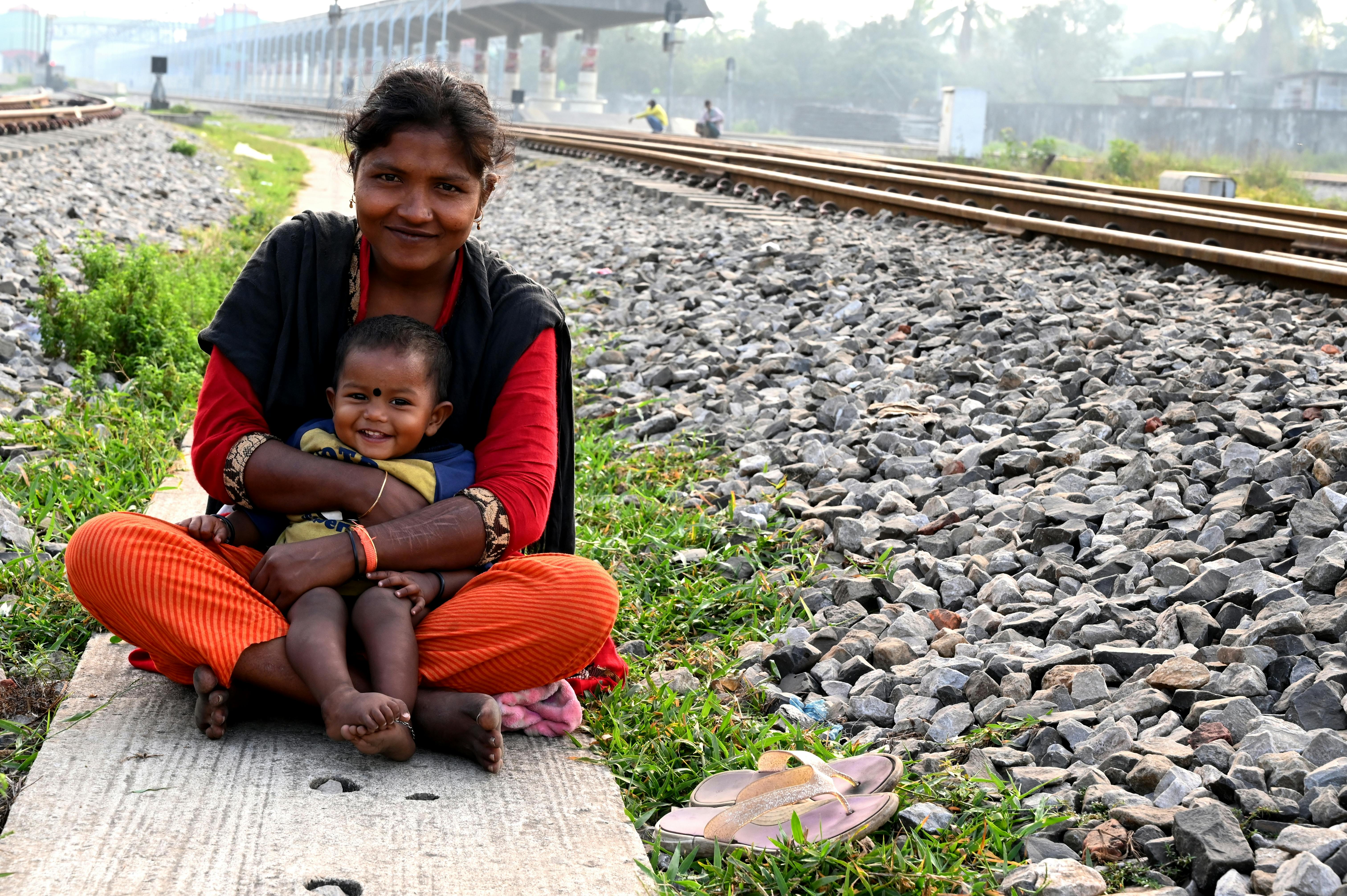 photo of woman holding her toddler