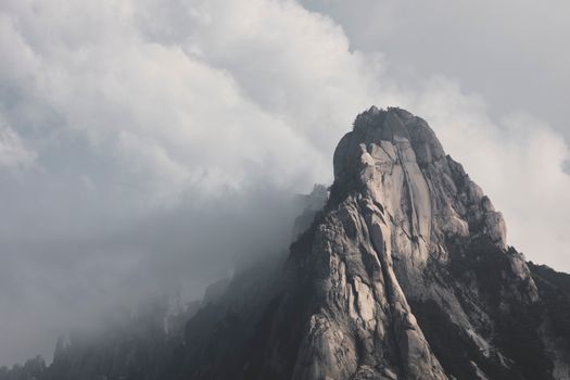 Dramatic view of a misty peak in Seoraksan National Park, South Korea, captured on a cloudy day.