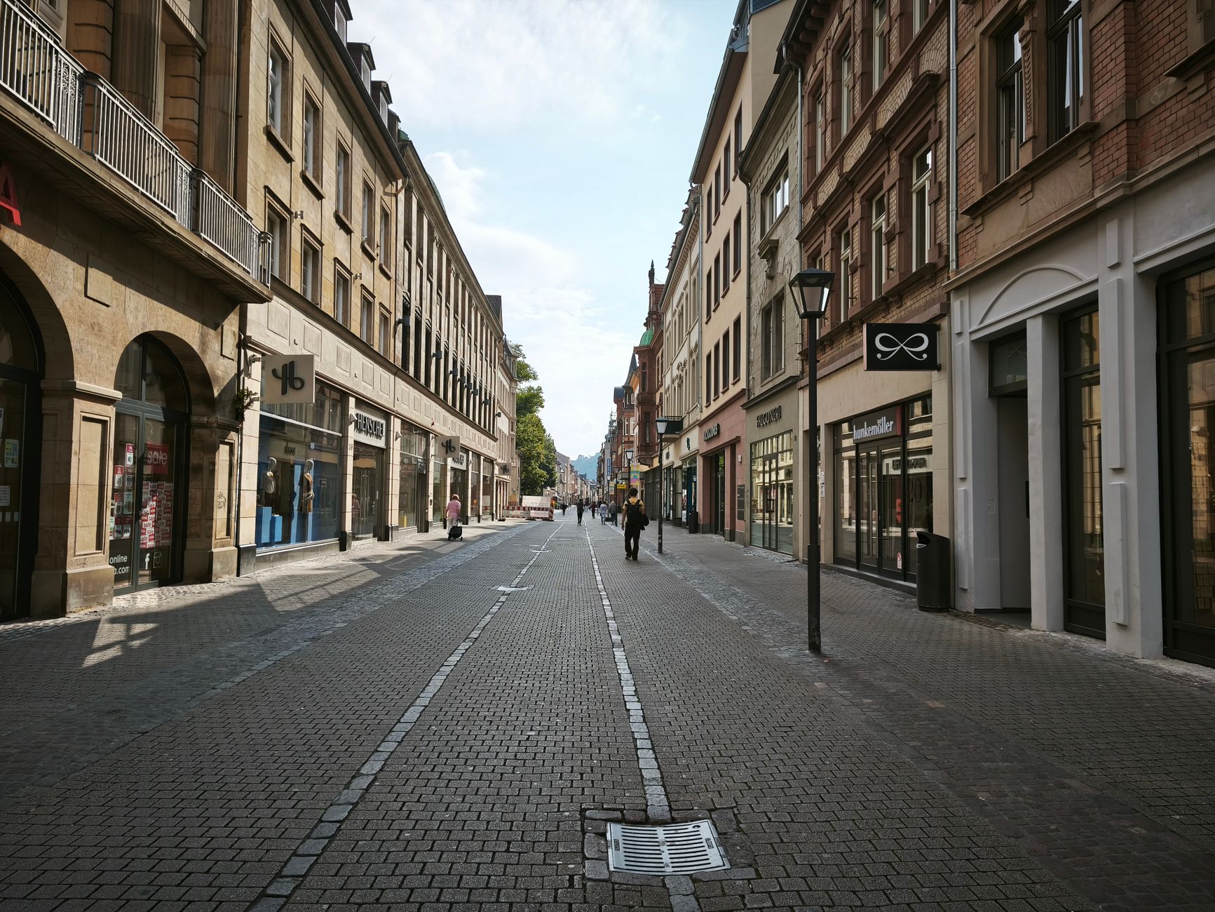 Cologne old town street with cafes and medieval buildings