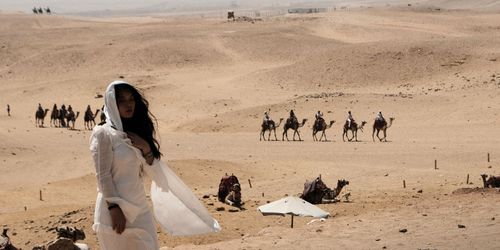 Free Desert Caravan and Woman in White Stock Photo