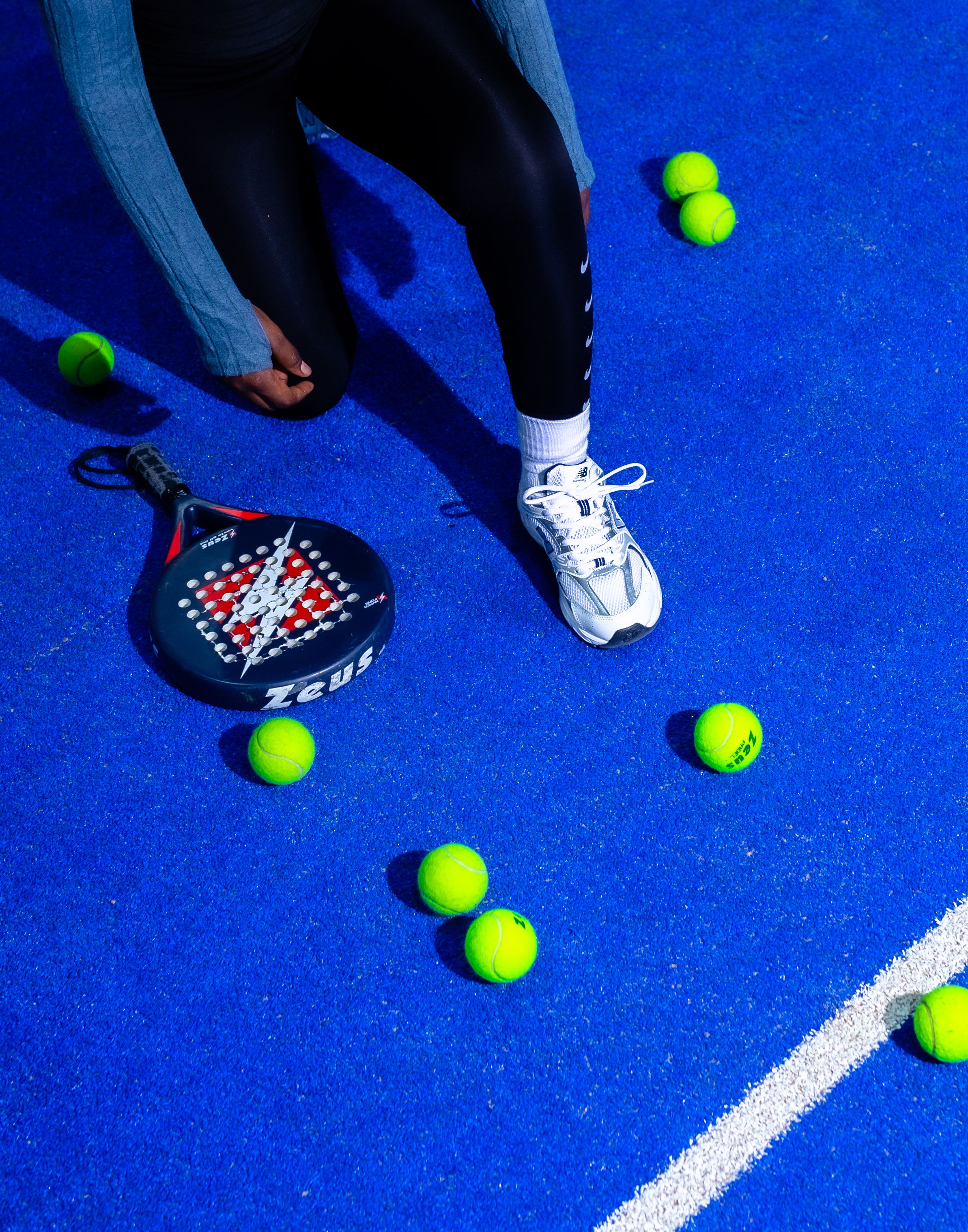 Dynamic Padel Scene on Vibrant Blue Court · Free Stock Photo