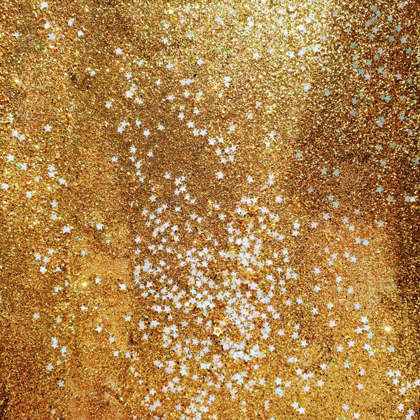 Golden metallic glitter texture — photo by Em Hopper on Pexels