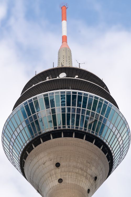 Free Detailed view of a modern communications tower against a clear sky Stock Photo