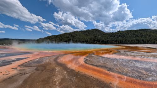 Free Colorful view of Grand Prismatic Spring with vibrant hues and clear sky in Yellowstone National Park. Stock Photo