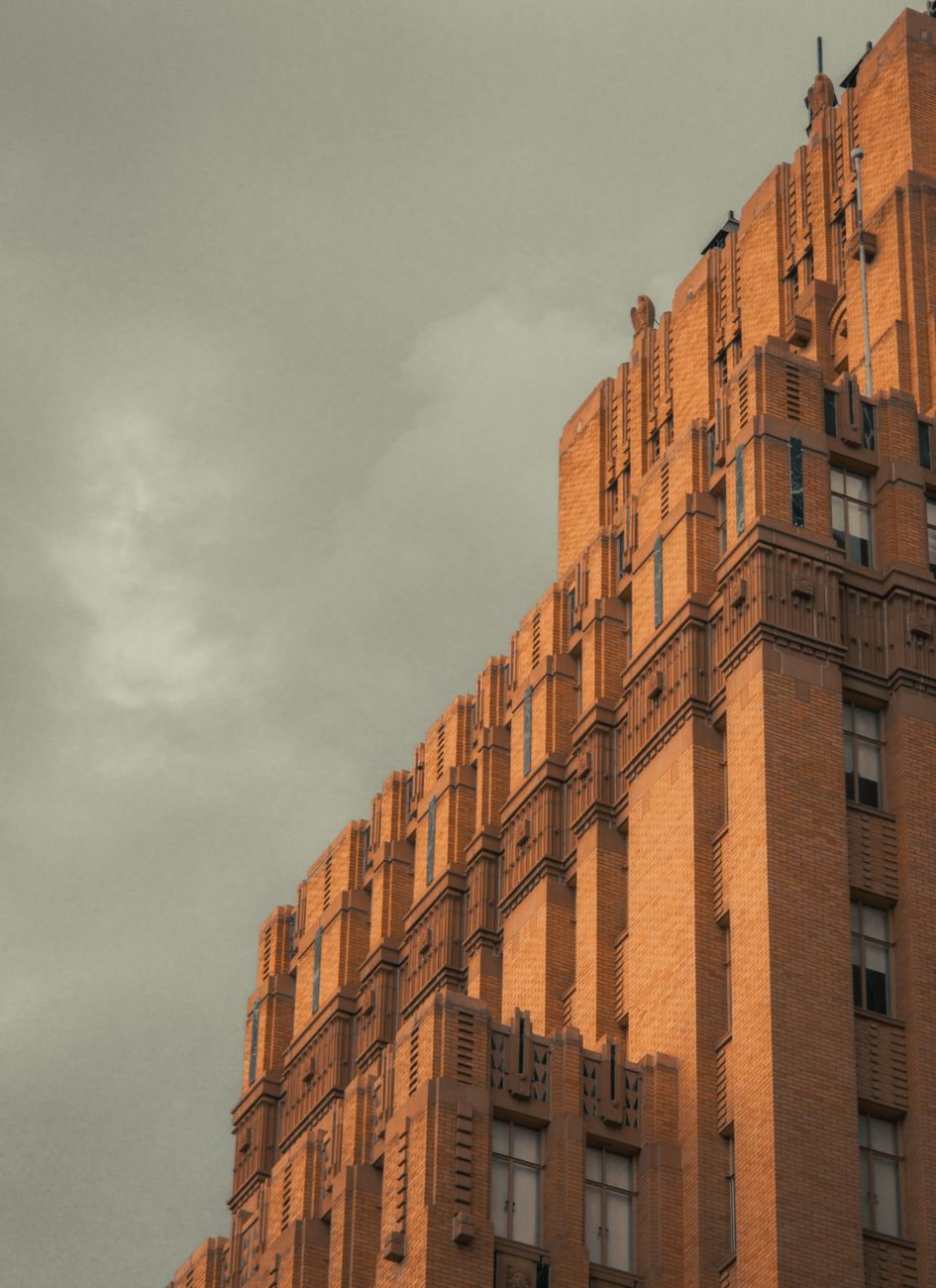 A striking Art Deco building in El Paso, Texas, set against a moody, overcast sky.. striking, deco, building