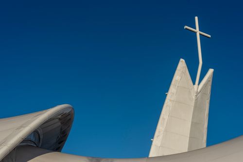 Free Striking modern church design with cross against clear blue sky in Maassluis, Netherlands. Stock Photo