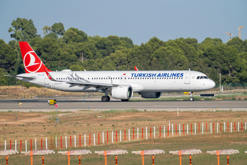 Free Turkish Airlines Airbus A321neo taxiing at Manises Airport on a sunny day. Stock Photo