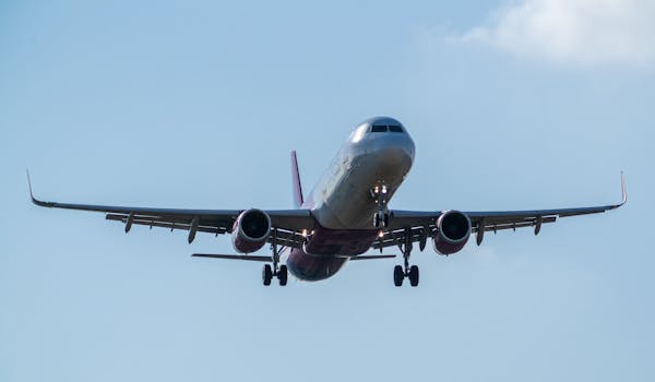 A commercial airplane prepares to land at Manises Airport in Valencia, Spain.