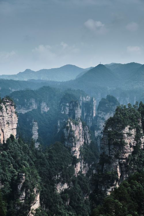 Free Scenic landscape of Zhangjiajie's iconic rock formations and lush forest. Stock Photo