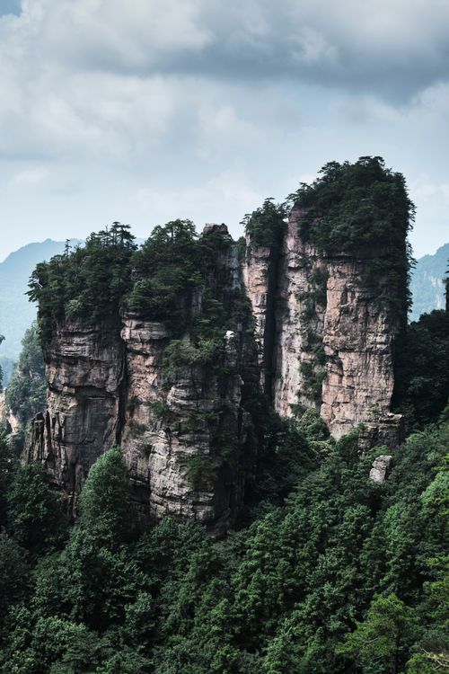 Free Stunning view of Zhangjiajie sandstone pillars surrounded by lush greenery in Hunan, China. Stock Photo