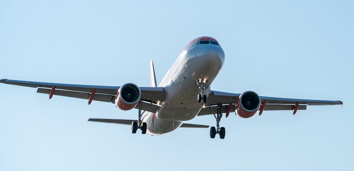 Airplane approaching for landing on a clear day in Manises, Community of Valencia, Spain.