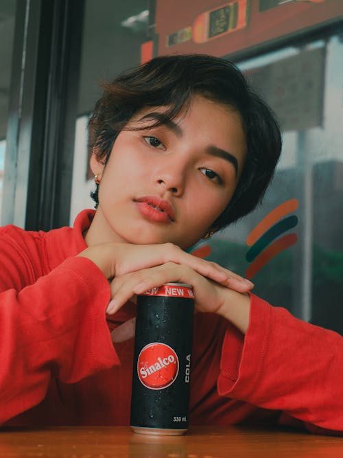 Woman Leaning on Sinalco Cola Can