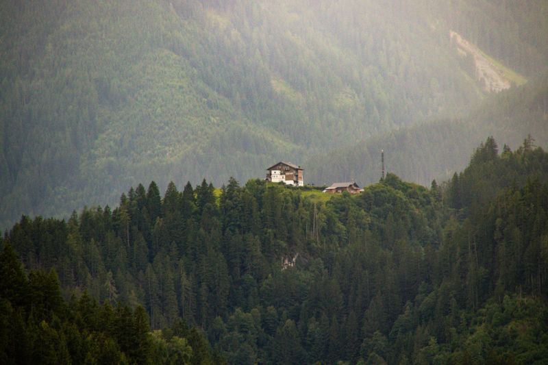 A chalet on a forested ridge — Freek Wolsink on Pexels