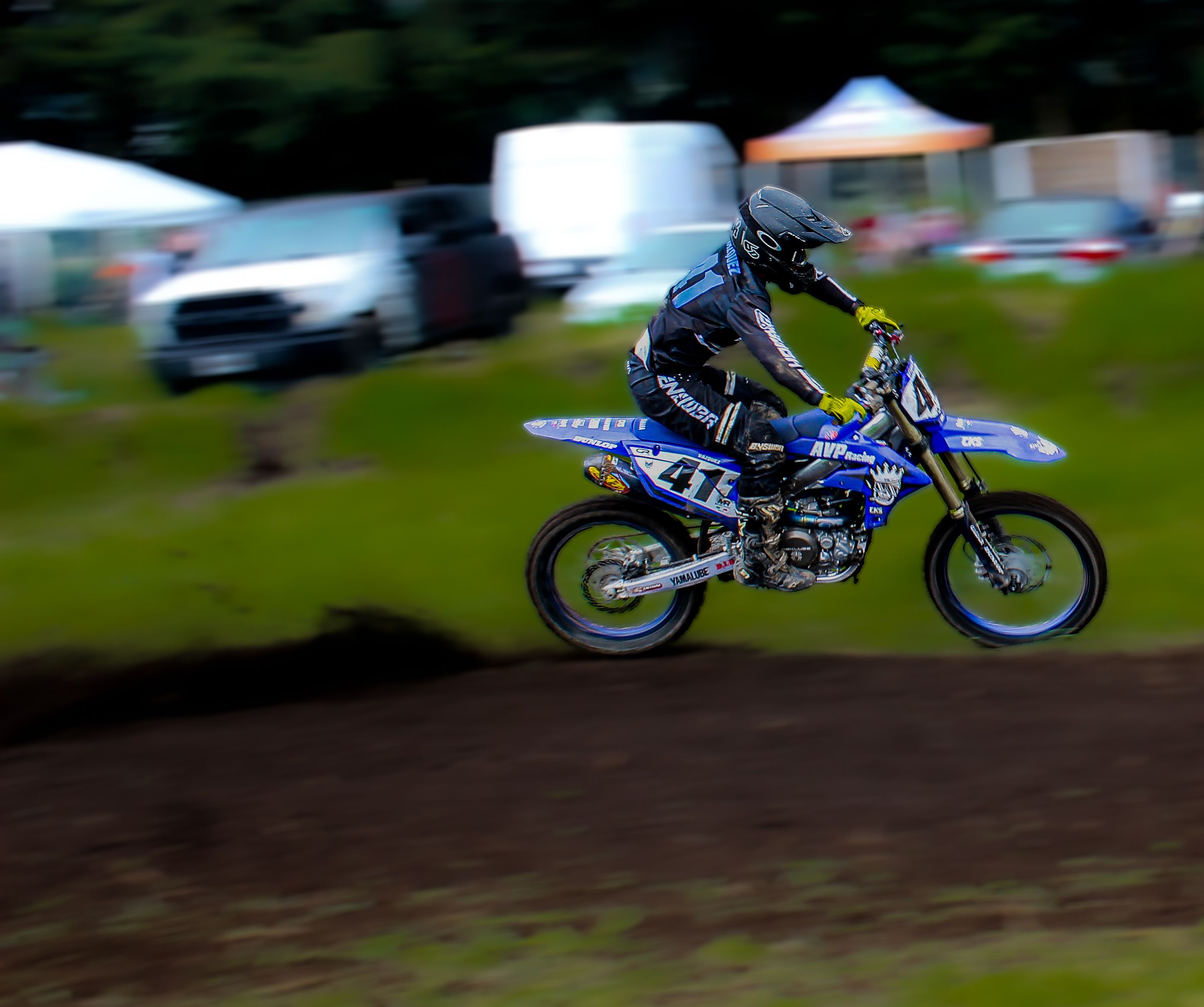 Dynamic Motocross Racer in Action on Dirt Track · Free Stock Photo