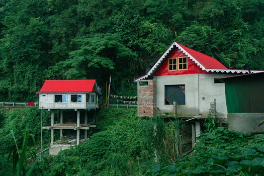 Charming houses with red roofs nestled in the lush hills of Darjeeling, India.
