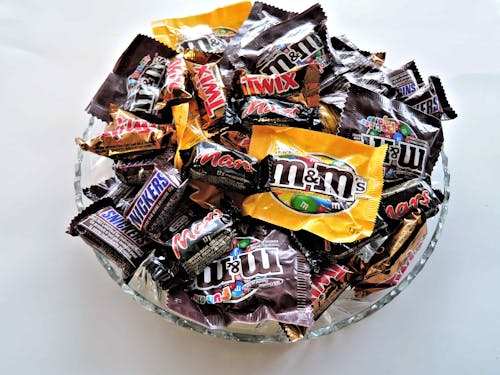 Free M and M on Clear Cut Glass Bowl Stock Photo