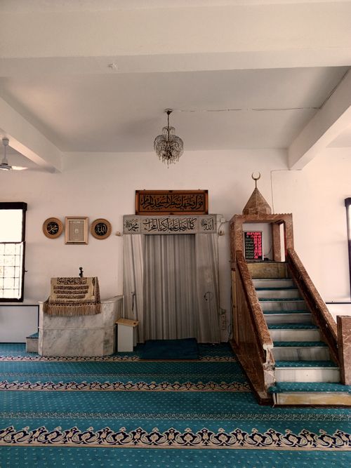 Free Peaceful mosque interior showcasing mihrab, minbar, and intricate Islamic art. Stock Photo
