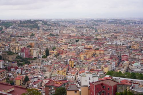 Free Panoramic view of Naples showcasing historic architecture and densely packed rooftops under an overcast sky. Stock Photo