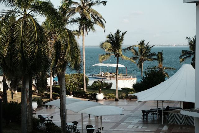 Tropical paradise with ocean views and palm trees at a luxury resort in Dar es Salaam, Tanzania. Related image for Hospitality in Africa: What Hotel Leaders Need to Know.