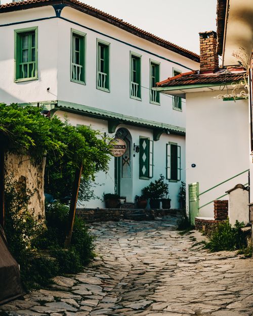 Free Picturesque street view in a quaint Mediterranean village, showcasing traditional architecture. Stock Photo