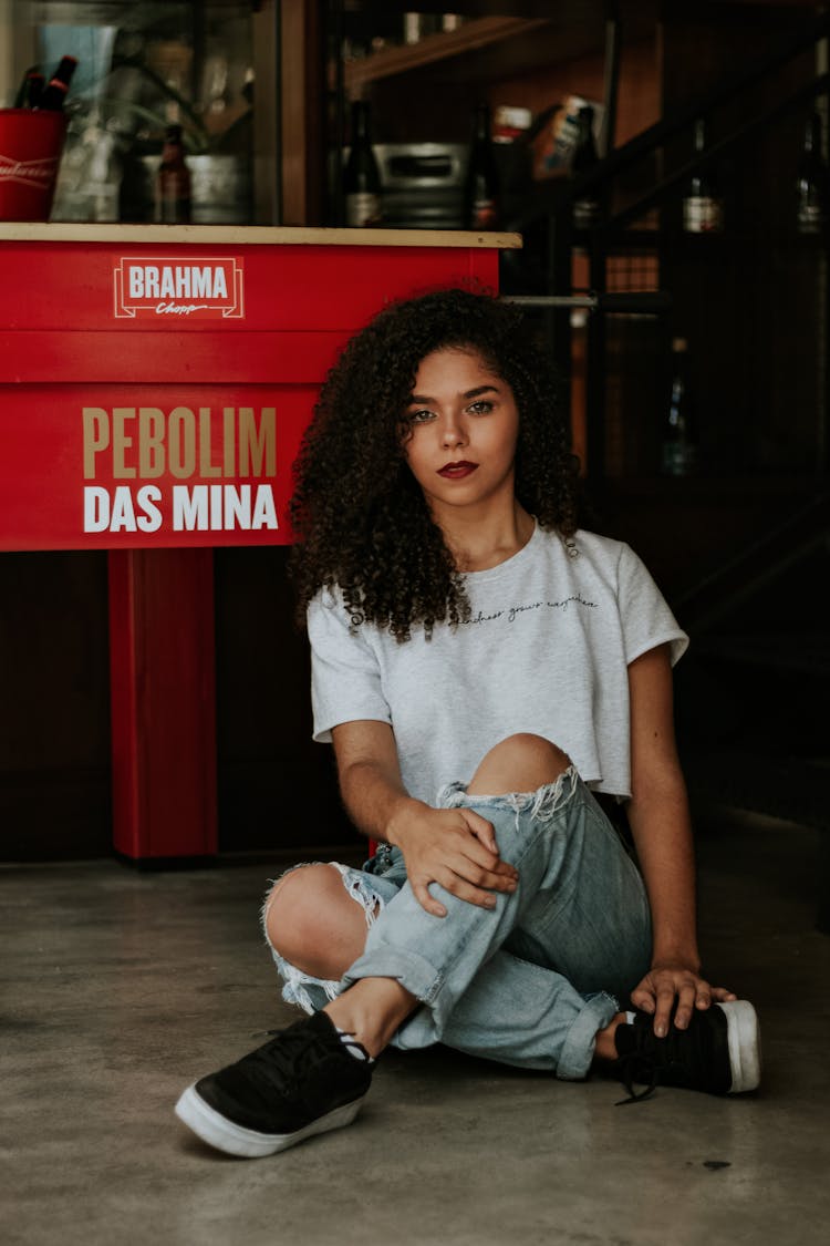 Photo Of Woman Wearing Tattered Jeans