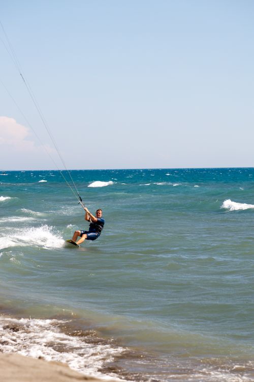 Free A thrilling kitesurfing experience on the vibrant waters of Ulcinj, Montenegro. Stock Photo