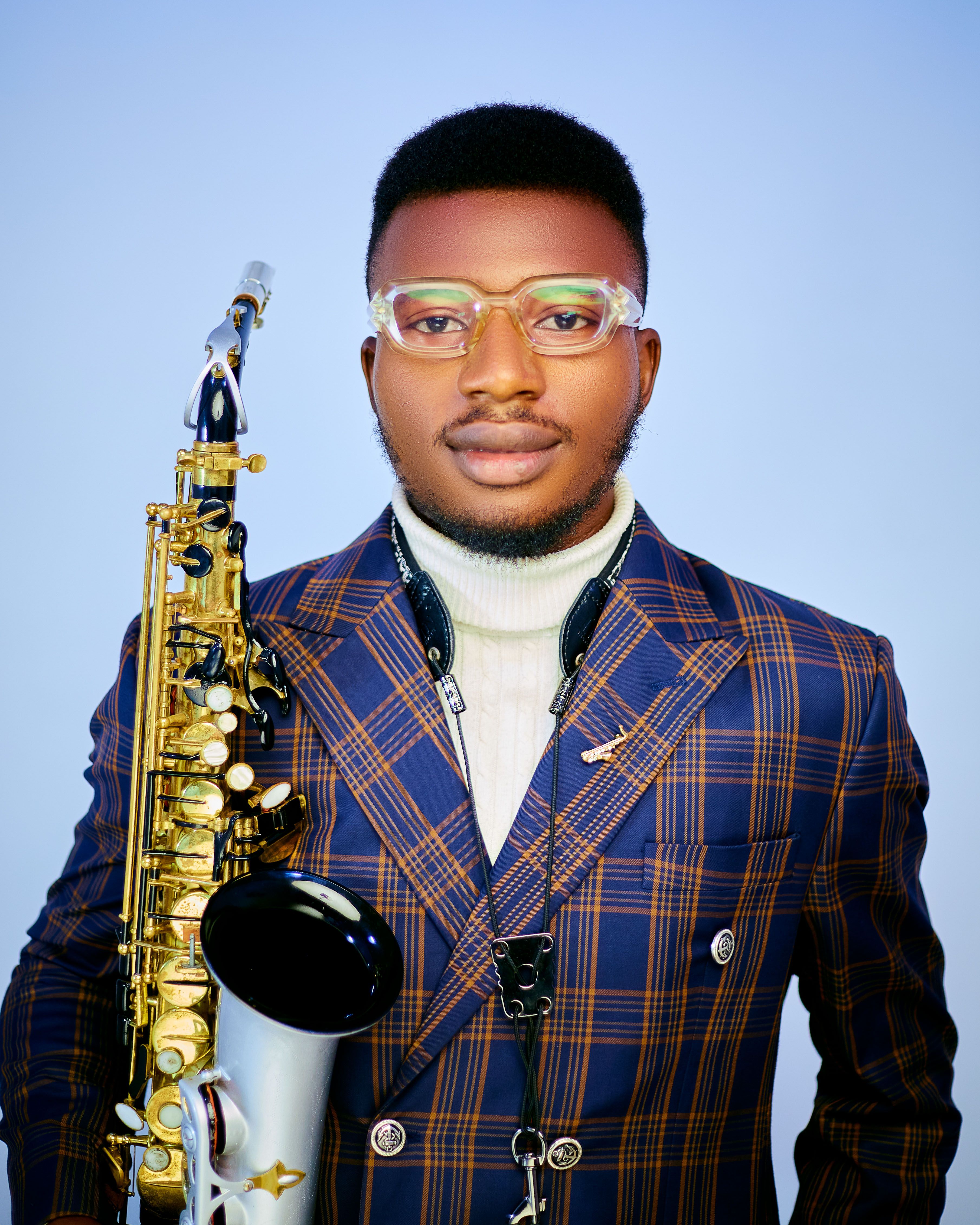Portrait of a Stylish Saxophonist with Instrument · Free Stock Photo