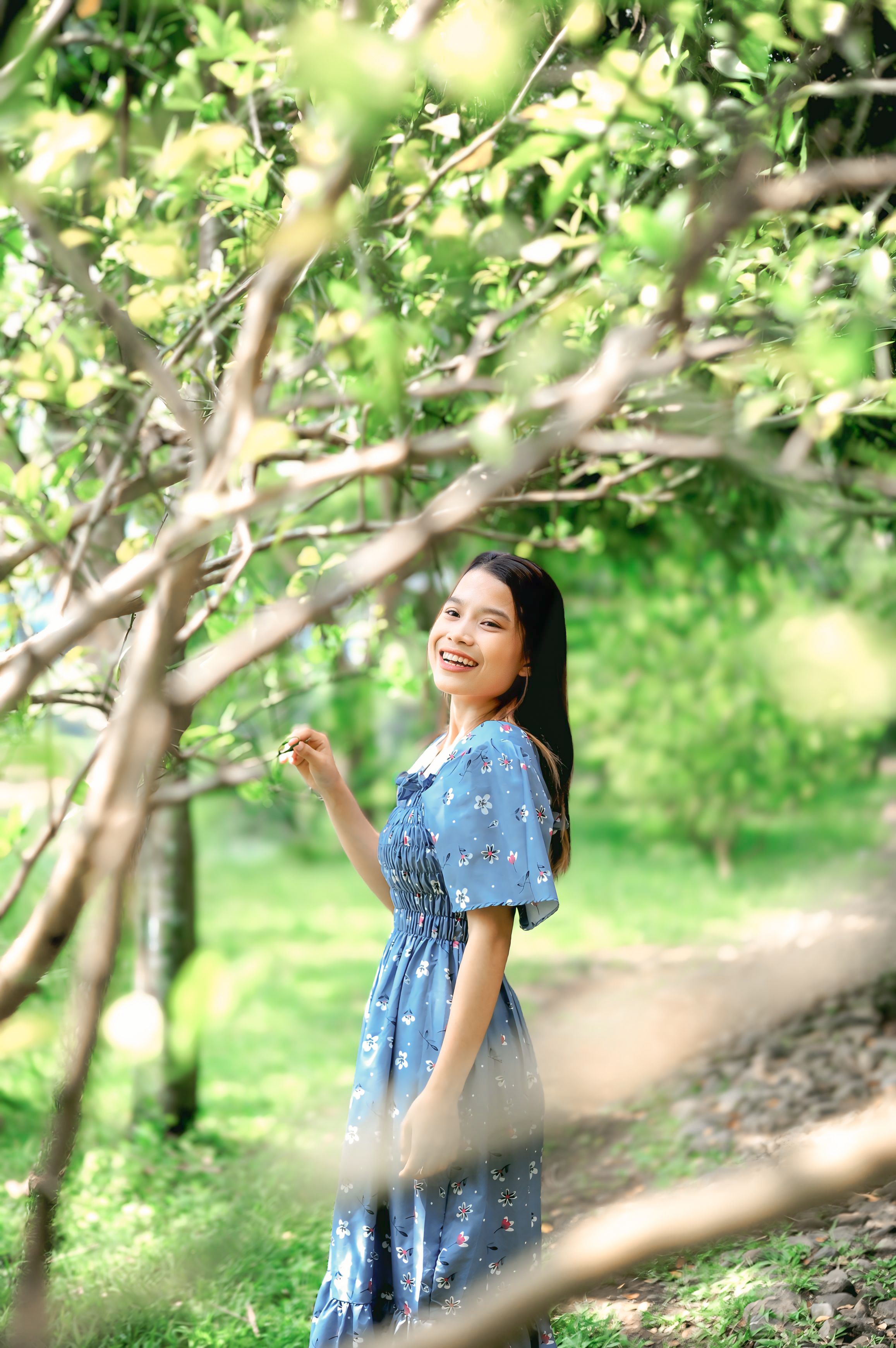 Joyful Woman in a Sunny Spring Garden · Free Stock Photo