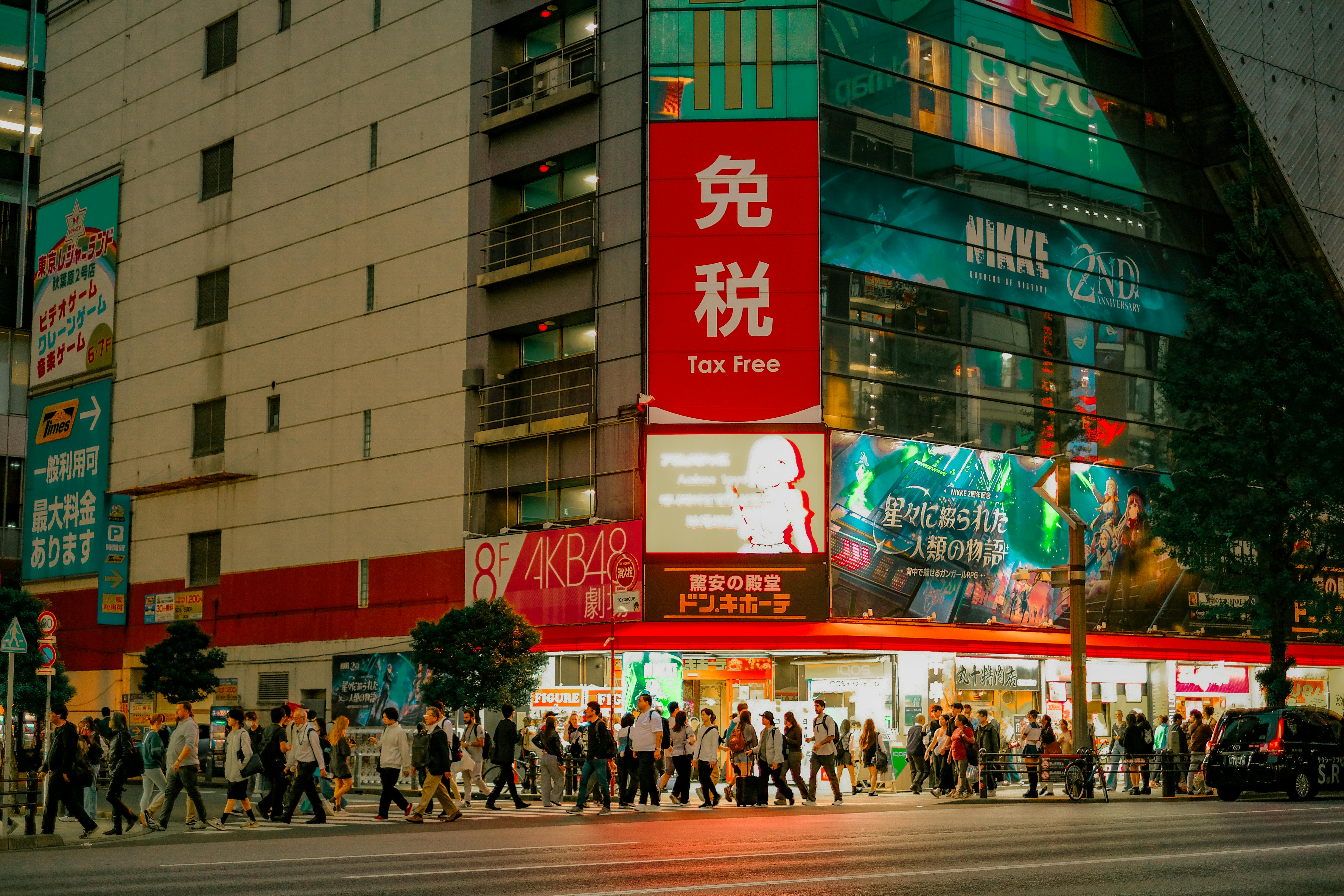 Tourist examining tax-free signage in a Tokyo retail store