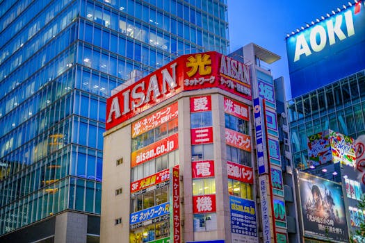 Brightly lit buildings in Shibuya, Japan featuring colorful signage and bustling urban atmosphere.