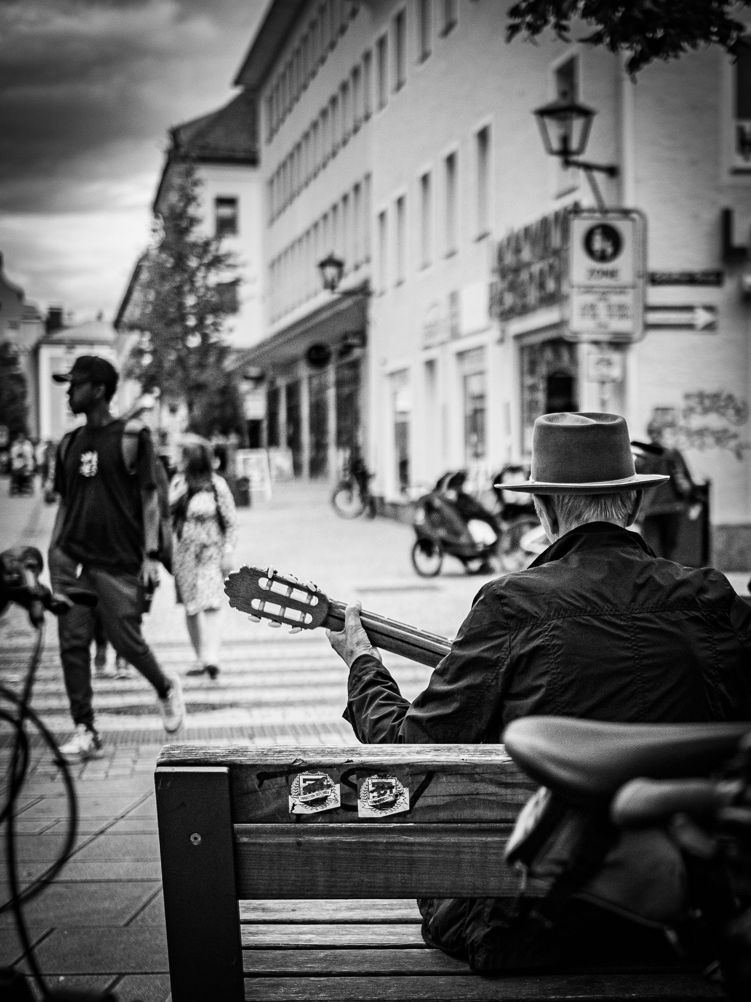 Street Musician Playing Guitar on Busy City Street · Free Stock Photo