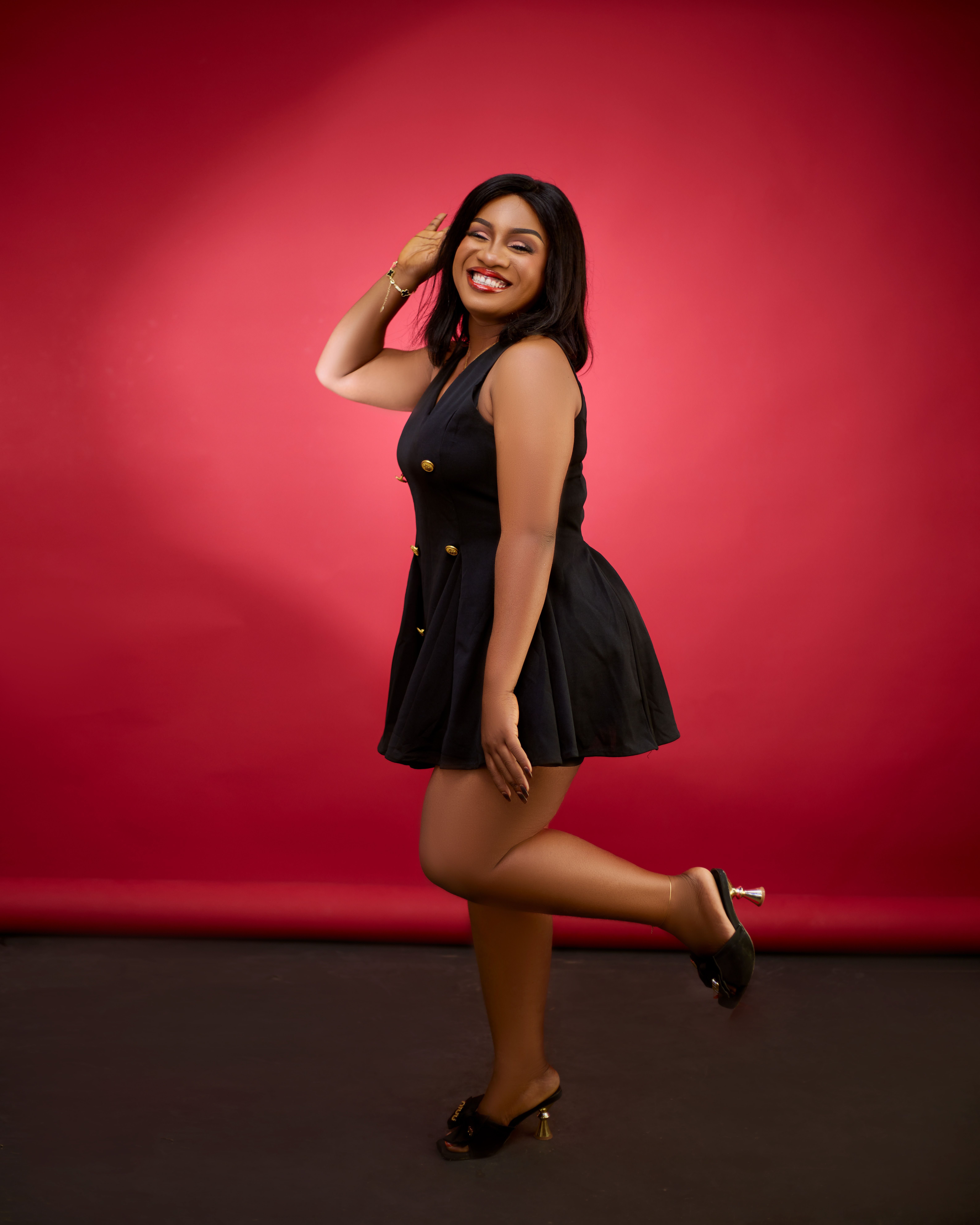 Elegant Woman Posing in Black Dress Studio Shot · Free Stock Photo
