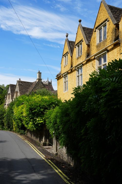 Free Picturesque street scene from a historic village in the Cotswolds, England. Stock Photo
