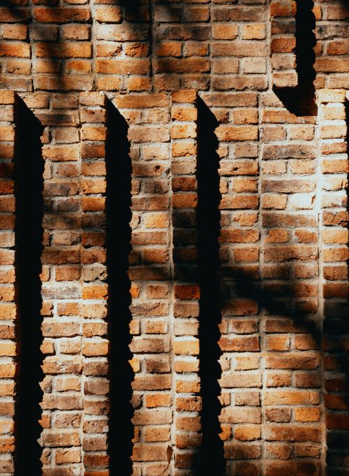 Free Abstract pattern of shadows on a textured brick wall in MG, Brasil. Stock Photo