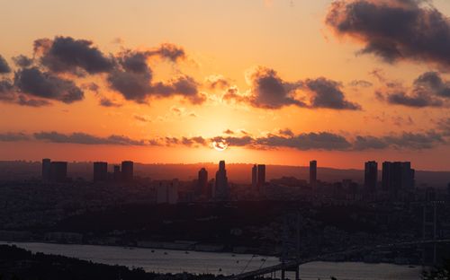 Free Stunning view of Istanbul's iconic skyline at sunset with vibrant clouds and Bosphorus Bridge. Stock Photo